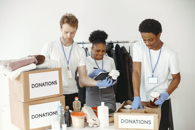 Volunteers labelling donation boxes